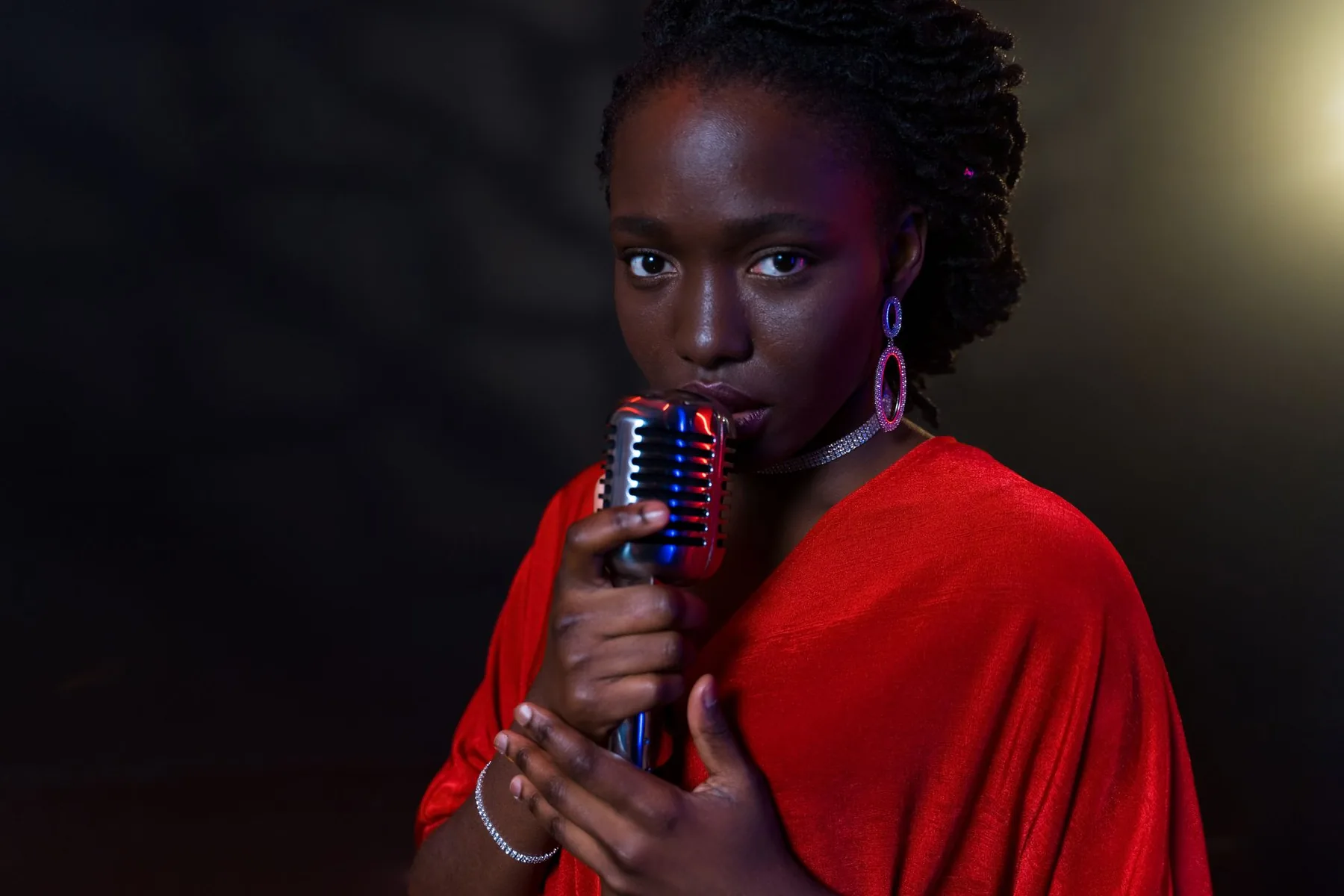 Singer in red at a vintage microphone