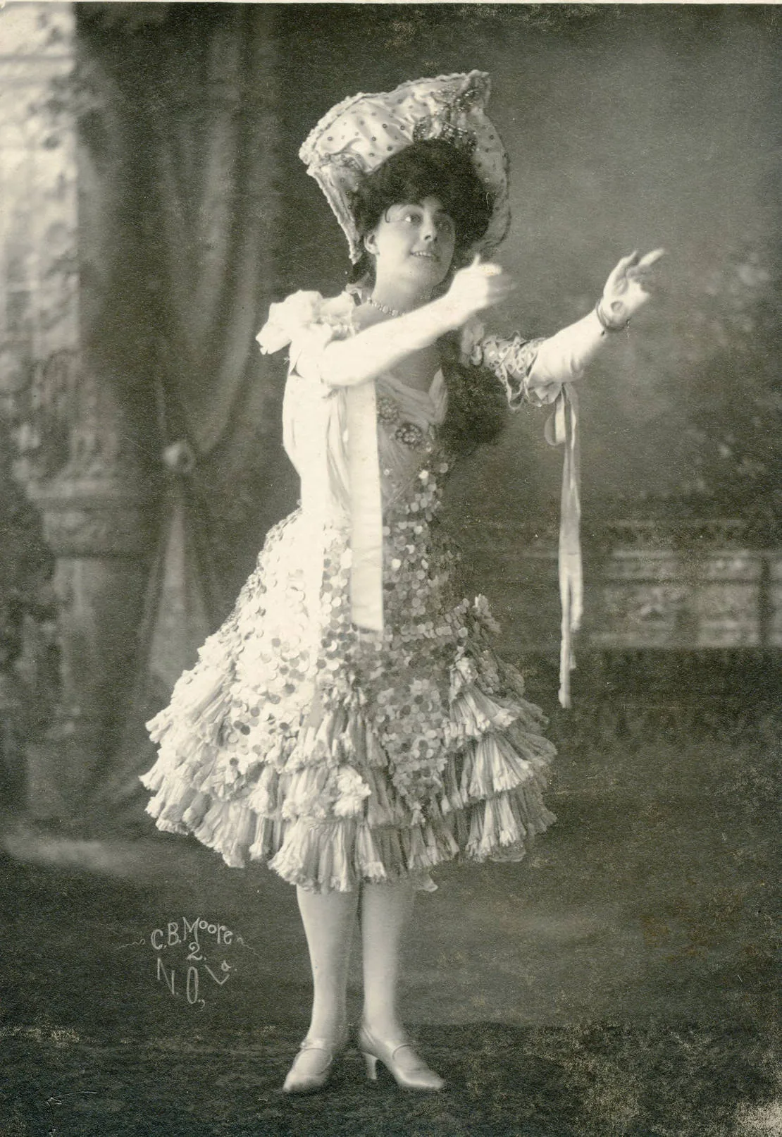 Performer in an elaborately ornamented stage costume Performer in an elaborately ornamented stage costume