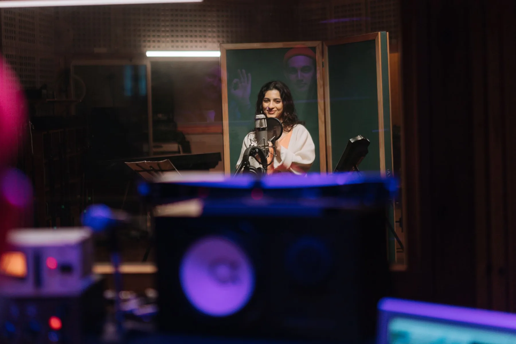 Singer in front of a microphone in a studio Singer in front of a microphone in a studio
