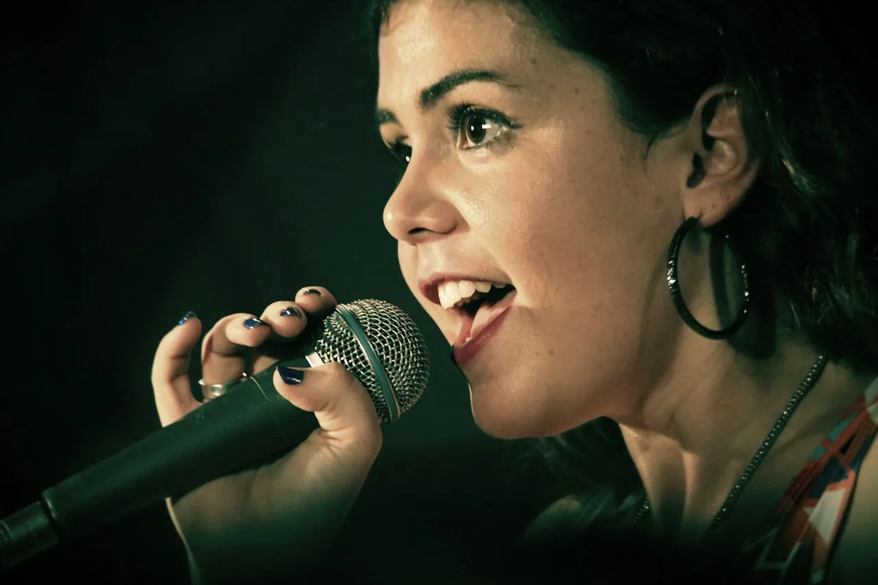 Singer at a microphone photographed in close-up Singer at a microphone photographed in close-up