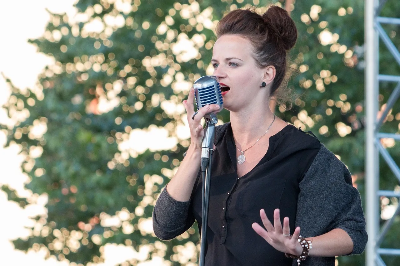 Singer outdoors at a retro microphone Singer outdoors at a retro microphone