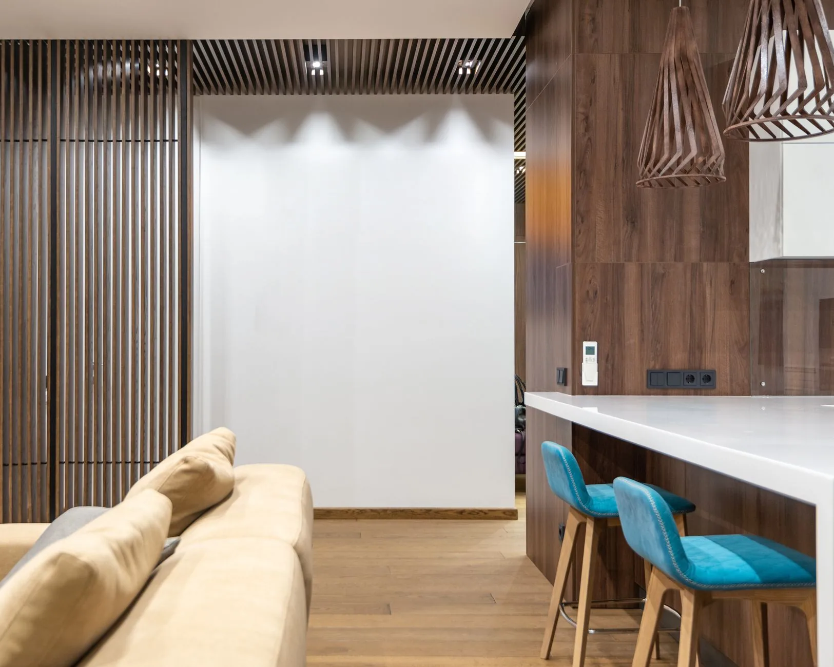 Apartment interior with wood paneling and a white counter Apartment interior with wood paneling and a white counter