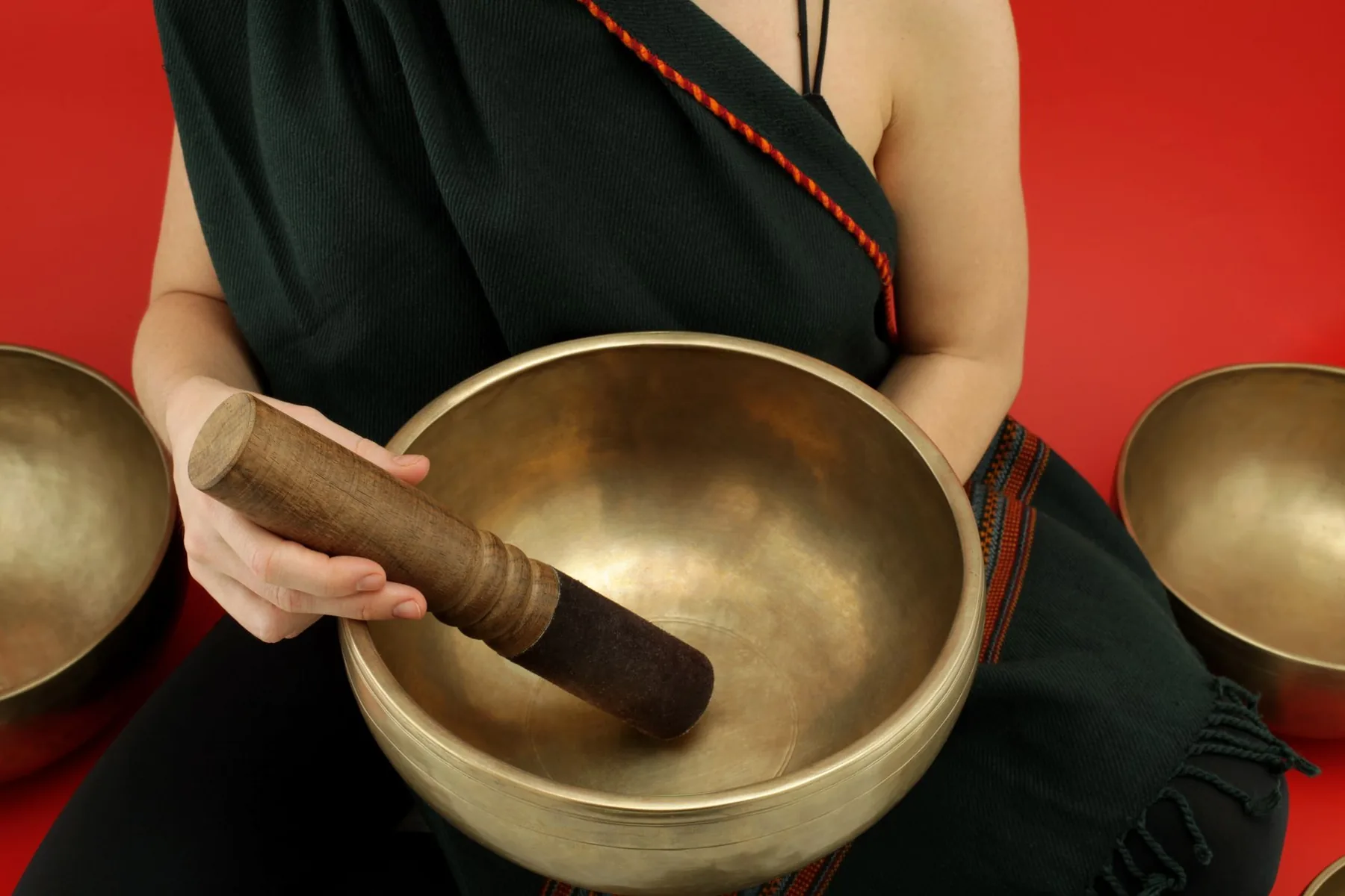 Tibetan singing bowl held with a mallet Tibetan singing bowl held with a mallet