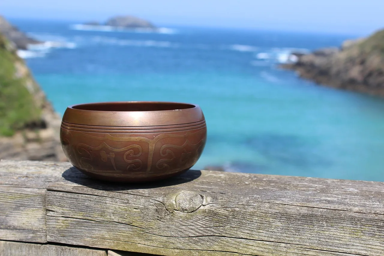 Engraved Tibetan singing bowl facing the sea Engraved Tibetan singing bowl facing the sea
