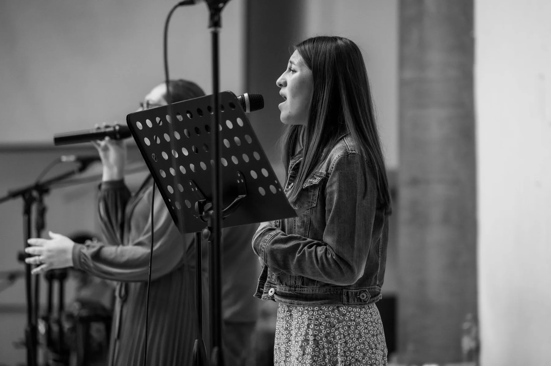 Singer at a music stand in black and white Singer at a music stand in black and white