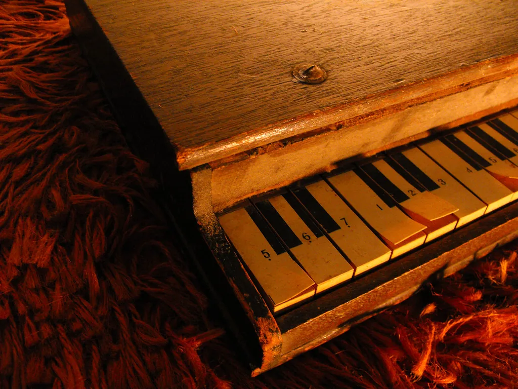 Small wooden piano with numbered keys