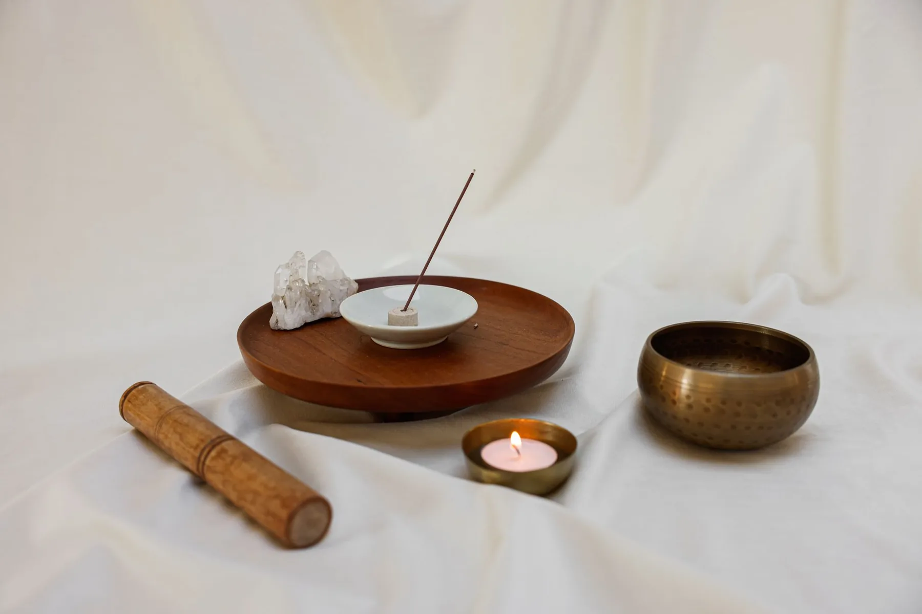 Singing bowl with incense and a lit candle Singing bowl with incense and a lit candle